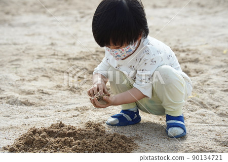 Playing with sand Playing with sand 90134721