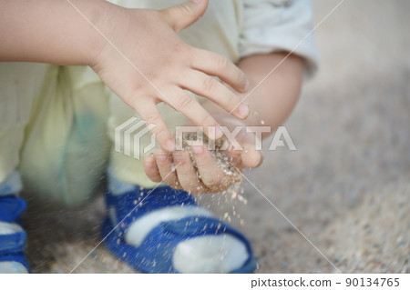 Playing with sand 90134765