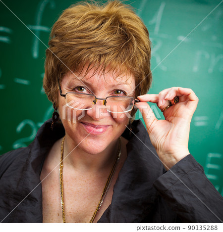 smiling teacher with glasses 90135288