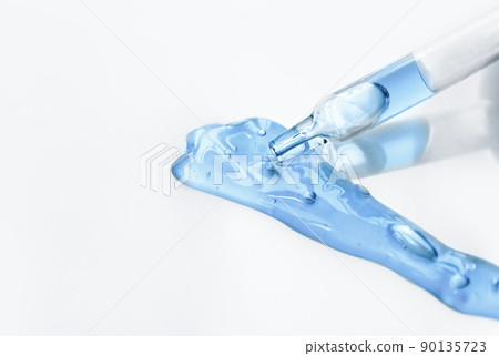 Pipette with fluid serum, oil, face gel cleaner. Cosmetics and healthcare concept closeup. Dose of retinol with air bubbles. Flat lay. Monkeypox, coronavirus research Pipette with fluid serum, oil, face gel cleaner. Cosmetics and healthcare concept closeup. Dose of retinol with air bubbles. Flat lay. Monkeypox, coronavirus research 90135723