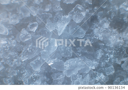 Coarse white iodized salt. Detailed background texture Macro close-up. Salt crystals of different sizes 90136134
