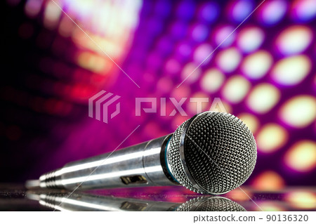 microphone against purple disco background microphone against purple disco background 90136320
