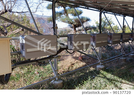 Behind the solar panel Behind the solar panel 90137720