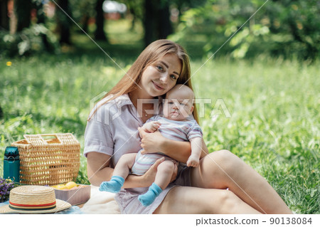 Mental Health in Postpartum Time. Maternal Mental Health. How to avoid pregnancy And Postpartum Disorders, postpartum baby blues, depression. Portrait of happy mother and newborn baby Mental Health in Postpartum Time. Maternal Mental Health. How to avoid pregnancy And Postpartum Disorders, postpartum baby blues, depression. Portrait of happy mother and newborn baby 90138084