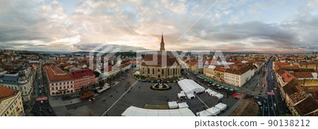Aerial drone panoramic view of Saint Michael Church in Cluj at sunset, Romania 90138212