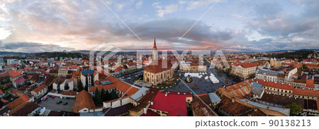 Aerial drone panoramic view of Saint Michael Church in Cluj at sunset, Romania 90138213