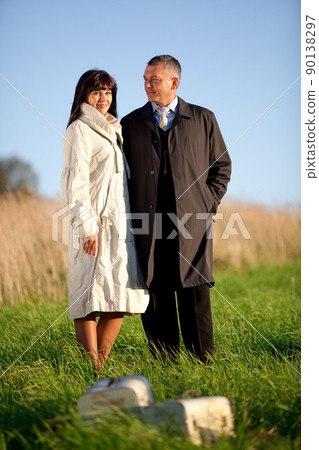 adult man and woman outdoors 90138297