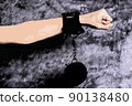 Hand with scars and handcuffs, abstrackt illustration 90138480