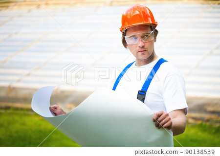 engeneer looking at the construction project engeneer looking at the construction project 90138539