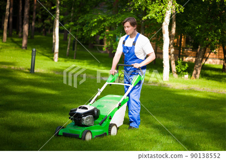 lawn mower man on the backyard lawn mower man on the backyard 90138552