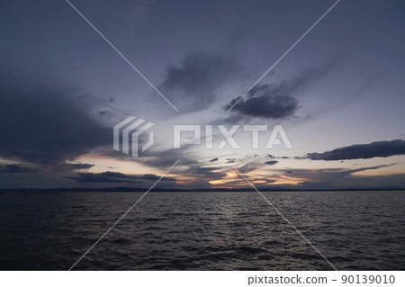 Landscape of a lake with storm clouds 90139010