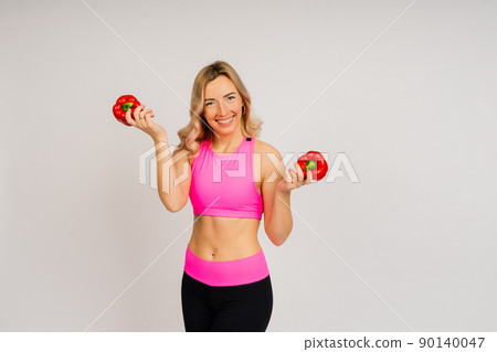Healthy eating, happy woman with fruits and vegetables is eating apple Healthy eating, happy woman with fruits and vegetables is eating apple 90140047