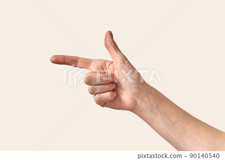 Female hand showing direction finger, arm on cream background. Female hand showing direction finger, arm on cream background. 90140540