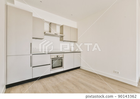 Interior of a kitchen in modern apartment Interior of a kitchen in modern apartment 90143362