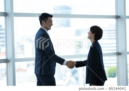 A businessman shaking hands A businessman shaking hands 90144041