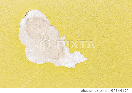 Yellow concrete weathered wall with flaking paint background/textured. Background and texture concept. 90144171