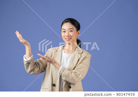 bright woman holding something invisible in hands Isolated studio 90147459