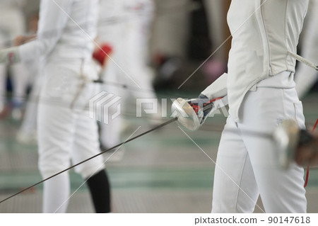 Young people fencers standing in the hall on a fencing tournament. No face shown 90147618