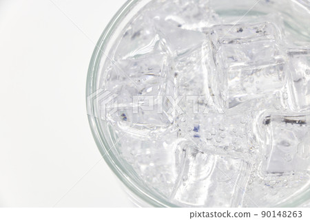 Soda sparkling water with Ice in glass over white background. 90148263
