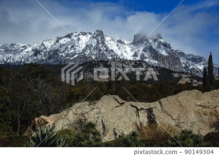 View of Ai-Petri mountains covered with snow from Vorontsov palace in Alupka. Crimea View of Ai-Petri mountains covered with snow from Vorontsov palace in Alupka. Crimea 90149304