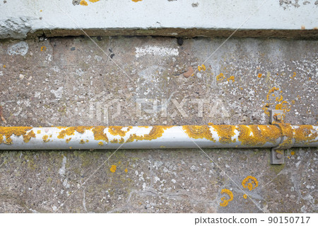 Metal pipe on the side of a bridge Metal pipe on the side of a bridge 90150717