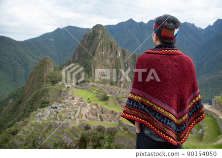 Asian man tourist looking at Machu Picchu Asian man tourist looking at Machu Picchu 90154050