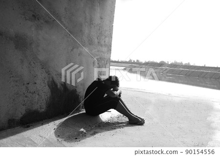 Silhouetted of sad photo. Lonely man sitting on the floor.He is unhappy and sad.He is depression.unlove,unhappy,fail.Photo concept for Disease and depression. Silhouetted of sad photo. Lonely man sitting on the floor.He is unhappy and sad.He is depression.unlove,unhappy,fail.Photo concept for Disease and depression. 90154556
