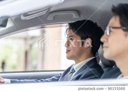 Business car driving, two middle-aged men Business car driving, two middle-aged men 90155088