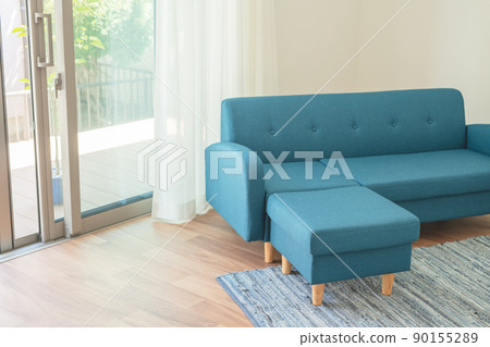 Blue sofa by the window Blue sofa by the window 90155289