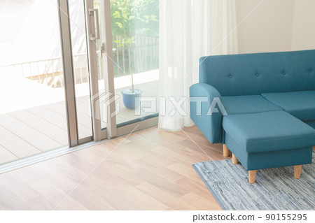 Blue sofa by the window 90155295