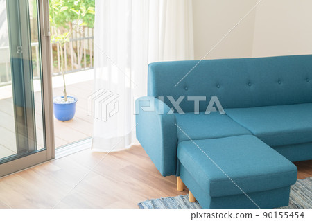 Blue sofa and wind swaying curtains Blue sofa and wind swaying curtains 90155454