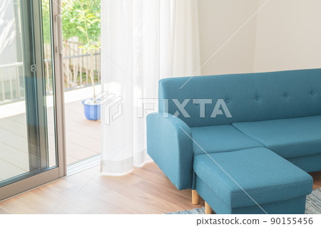 Blue sofa and wind swaying curtains Blue sofa and wind swaying curtains 90155456