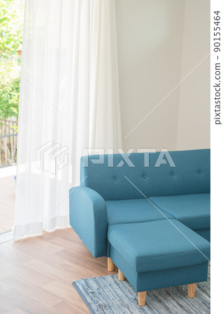 Blue sofa and wind swaying curtains Blue sofa and wind swaying curtains 90155464