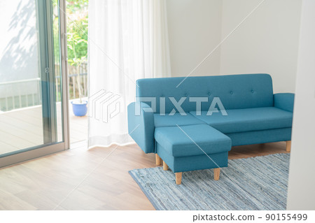 Blue sofa and wind swaying curtains Blue sofa and wind swaying curtains 90155499