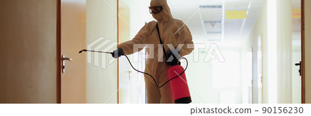 A man in a protective suit splashes on the door A man in a protective suit splashes on the door 90156230