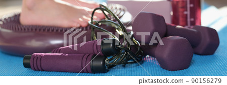 Man stand on a massage mat, legs close-up 90156279