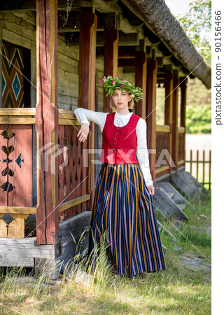 Latvian woman in traditional clothing. Ligo folk. Latvian woman in traditional clothing. Ligo folk. 90156466