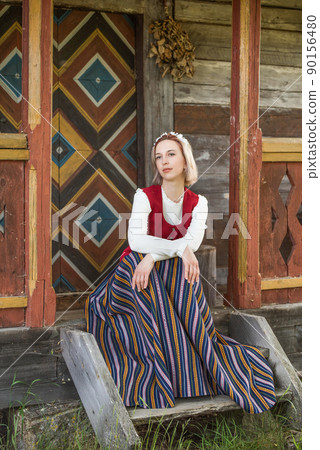 Latvian woman in traditional clothing. Ligo folk. 90156480