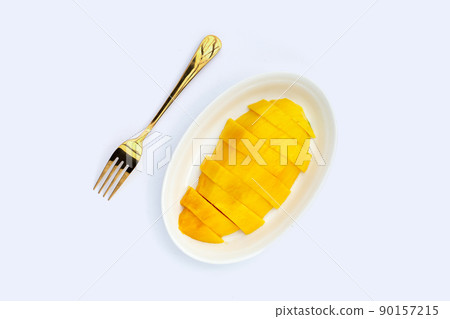 Yellow mango slices on white background. 90157215