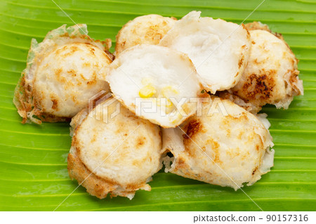 Khanom Krok, Thai coconut milk dessert. Coconut rice pancake Khanom Krok, Thai coconut milk dessert. Coconut rice pancake 90157316