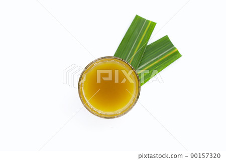 Glass of fresh squeezed sugar cane juice. Top view 90157320
