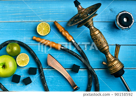 Hookah. Tobacco with apple and lime flavor. Top view 90158592