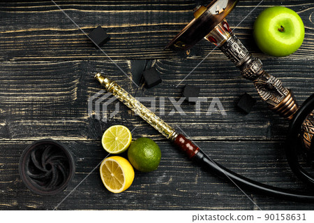 Arabic hookah with a tobacco flavor of a mixture of citruses and apple 90158631