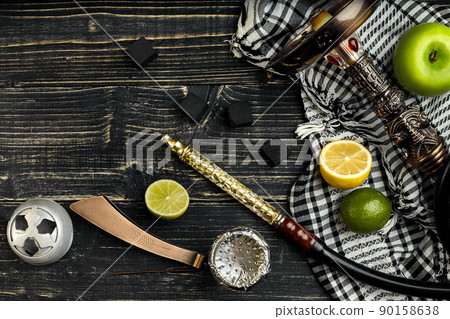 Arabic hookah with a tobacco flavor of a mixture of citruses and apple 90158638