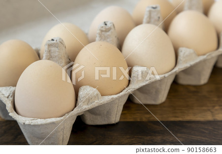 Organic chicken eggs, in a cardboard tray, close up. Organic chicken eggs, in a cardboard tray, close up. 90158663
