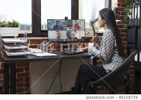 Woman in business video call conference meeting communicating to company multicultural colleagues new financial project idea. Agency employee presenting to work team profitable marketing methods. Woman in business video call conference meeting communicating to company multicultural colleagues new financial project idea. Agency employee presenting to work team profitable marketing methods. 90158739