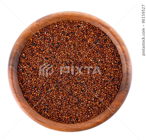 Canihua grains isolated on white background. Pile of qaniwa in wooden bowl. Dry grains of chenopodium pallidicaule. Top view. 90159527