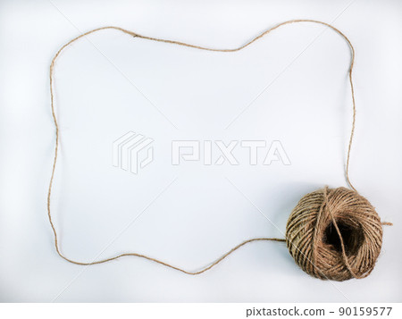 coiled raw rope Made of various fibers into a long rope. is stretched into a frame with a space to insert text in the middle For brown crafts, white background isolated, studio shot. coiled raw rope Made of various fibers into a long rope. is stretched into a frame with a space to insert text in the middle For brown crafts, white background isolated, studio shot. 90159577