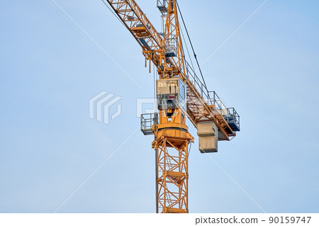 Close up details with a cabin control of a construction crane. High quality photo Close up details with a cabin control of a construction crane. High quality photo 90159747