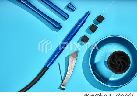 Top view of Hookah parts on light blue background 90160148